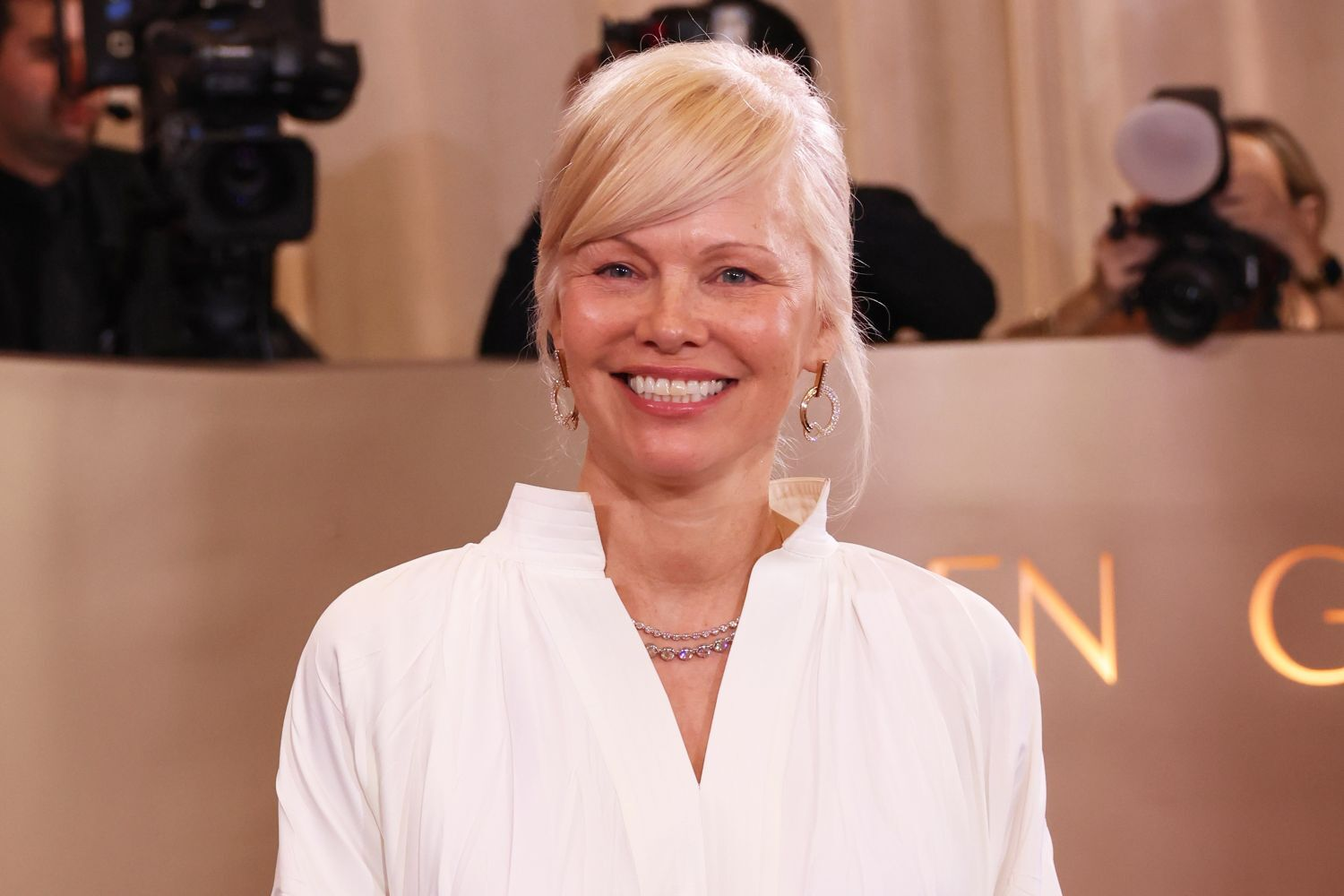Pamela Anderson’s Summer Maxi Is the Unexpected Fall Staple You Need
